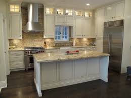 No kitchen design is complete without a stylish backsplash. Whitewashed Brick Backsplash Tile With White Kitchen Cabinets