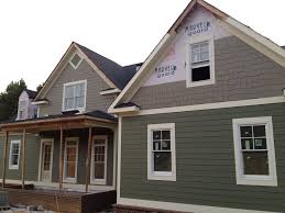 Soffits are key construction elements—they cover the underside of your roof eaves and exterior porch ceilings. My Builder Suggested I Look At Hardie Board Smooth Soffit Material Which Looks Nice Online But He Sai Green House Exterior Exterior House Colors House Colors