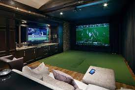 Golf Movies Share Space In Doubly Fun Home Theater Electronic House Golf Room Media Room Design Home Theater Seating