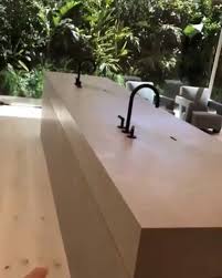 Match this with a solid oak block worktop stretched the full length of a bespoke island. Kim Kardashian Explains How Her Bizarre Bathroom Sink Works Video Sa411
