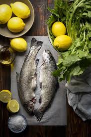 Simple Broiled Rainbow Trout With Dandelion Greens Recipe Fish Food Photography Trout Recipes Fish Recipes