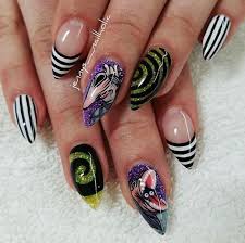 Black And White Striped Nails Halloween Green Glitter Black White Stripes Stiletto Nails Purple Glitter Different Decortion Halloween Nail Designs In 2020 Halloween Nail Designs Goth Nails Halloween Nails