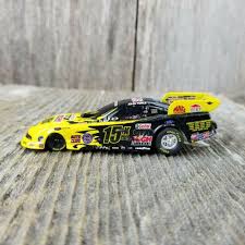 Top alcohol refers to two different classes in professional drag racing: Castrol Gtx John Force Ford Mustang Funny Car Yellow Racing Metal Unbranded Car Humor Ford Mustang Mustang