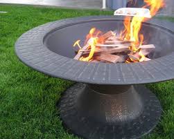 Salvage a tree trunk or another large chunk of wood that's cut flat on the bottom so it will stand on end. Portable Fire Pit Styles Landscaping Network