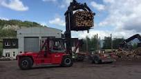 Kalmar forklift truck with a grapple attachment handling timber