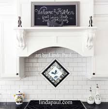 Black And White Kitchen With Dragonfly Hand Painted Glass And Mosaic Tile Backsplash Medallion White Glass Tile Kitchen Backsplash Designs Backsplash Designs