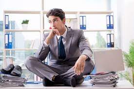 Premium Businessman Sitting On Top Of Desk In Office Photo Download In Png Jpg Format Business Man Mens Dress Socks Well Dressed Men