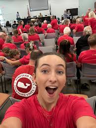 https://www.youtube.com/watch?v=dEHctlC56gU The board was looking onto an  audience of over a 100 teachers with red shirts. A sea of red filled the  library.