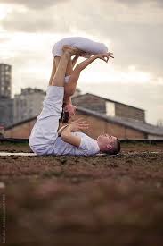 Couple Doing Acro Yoga By Lumina Couples Yoga Poses Partner Yoga Couples Yoga
