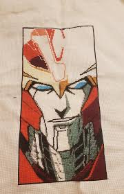 Recreation of babygirl Rodimus panel using needlepoint