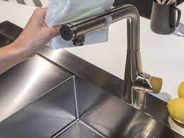 Use toilet cleaner.simply pour it on.leave for a while then rinse it off with plenty of cold water and buff using paper towel. How To Clean High Quality Kitchen Taps Properly Hansgrohe Int