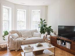 Aligning a couch with its back in front of a window is often a logical choice. 10 Simple Decorating Rules For Arranging Furniture