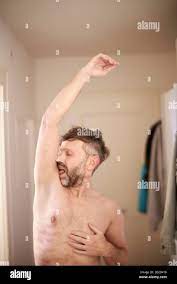 Man licking his armpit Stock Photo - Alamy