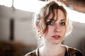 Woman Lying On Ground" by Stocksy Contributor "J Danielle Wehunt"