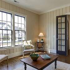Paint the brick and paneling cottage white by behr. Painting Wood Paneling Paneling Makeover Wood Paneling Makeover Traditional Living Room Paint