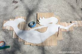 Combine a seashell table lamp with a wall sculpture featuring conches, sand dollars and starfish. Seaglass And Cedar Mermaid Art Sand And Sisal