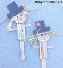 You can draw on his smile with a brown or black marker. Scarecrow Popsicle Stick Craft The Keeper Of The Cheerios Craft Stick Crafts Crafts Scarecrow Crafts
