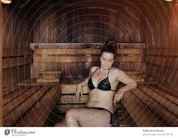 Adult female relaxing in sauna - a Royalty Free Stock Photo from Photocase