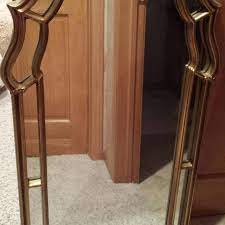 This mirror features a beautiful elegant frame with a shell motif at the top, along with other foliate designs. Best Carolina Mirror Company Gold Vintage Mirror For Sale In Appleton Wisconsin For 2021