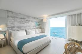 The Serafina Beach Hotel Celebrates The Sand And Surf Culture Of San Juan Puerto Rico Hotel Room Design Bedrooms Hotel Room Design Beach Hotel Room