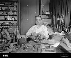 Vintage photo of shoemaker Black and White Stock Photos & Images