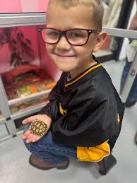 My 6 yr old son with 105 yr old tortoise. So Cool