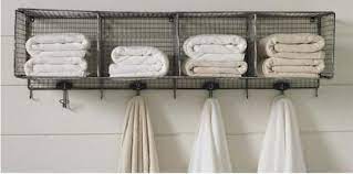 Curvy, shiny chromed towel racks with decorated washers that remind of the star shaped tap knobs. Design Sleuth Wire Towel Rack In The Bath Remodelista Bathroom Towel Storage Diy Bathroom Diy Bathroom Decor