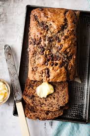 This Chocolate Chip Banana Bread Made With Sour Cream Is The Fluffiest Moist Banan Banana Chocolate Chip Chocolate Chip Banana Bread Banana Bread Recipe Moist