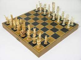 3 3/4 tall pawns, 4 1/2 tall rooks with flags and elephants, 3 3/4 tall standing bishops, 4 1/4 tall knights on horseback, 6 tall queen, 7 1/2 tall king. A Cased Ivory Puzzle Ball Chess Set With Oriental Character Pieces King 6ins