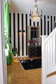 Tented striped wallpaper (farrow & ball) transforms a space over the garage at this florida family retreat designed in the guest room of this california home designed by ken fulk, floral wallpaper with a black ground infuses the. Main Entry Black And White Striped Wallpaper Striped Wallpaper Living Room Striped Wallpaper Decor Feature Wall Bedroom