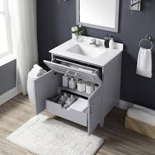 Where is the sink located for products within bathroom vanities? Ove Decors Denver 30 W X 22 D Pebble Gray Vanity And White Cultured Stone Vanity Top With Rectangular Undermount Bowl At Menards