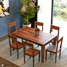 This dining table comfortably seats four, and pairs well with chairs having an 18 to 19 seat height. Llyssa Solid Wood 6 Seater Dining Table Decornation