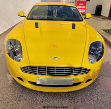 Image result for Sunburst Yellow 2012 Aston Martin