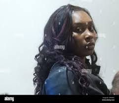 Brooke Wilson-Johnson, 19, a former cafeteria worker at Campus Elementary,  enters the courtroom