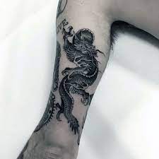50 Small Dragon Tattoo Ideas For Men 2021 Inspiration Guide Dragon Tattoo Small Dragon Tattoos Dragon Tattoos For Men