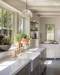 Glossy Surfaces And Plenty Of Windows Make This Kitchen Oh So Sunny And Peaceful Jessica Helgerson Inte Home Remodeling House Interior Beautiful Kitchens