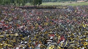 Spotlight of a bike-graveyard: abandoned sharing-bikes piled up in ...
