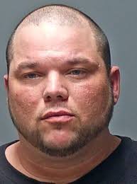 Manchester man charged with threatening driver with a gun