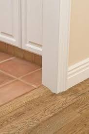 How To Attach A Threshold Floor Reducer To Ceramic Tile Baseboards Flooring Tile Baseboard