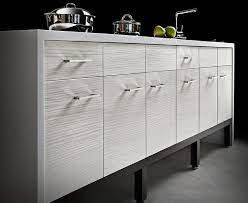 If you're not sure about doing your whole kitchen in this style, mix it with white uppers, or use wood cabinets only for an island. White Textured Kitchen Cabinets Studio Haus