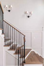 Beautiful Stairwell Boasts A Wood Banister With Iron Spindles Alongside Thomas O Brien Vendome Double Sc Staircase Sconce Wainscoting Styles Wainscoting Height