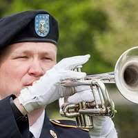 Petty Officer 2nd Class Eric Cavender plays the tuba