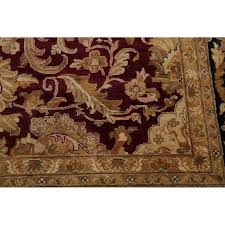 Ideal for use indoors, this area rug sports delicate motifs and artistic floral patterns that are centered on an oriental theme and spread against a deep burgundy background. Agra Indian Floral Hand Made Wool Large Area Rug 17 7 X 11 10 On Sale Overstock 26878986