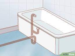 Combine 2 parts vinegar and 1 part water in a spray bottle and spray the entire bathtub. How To Install A Bathtub With Pictures Wikihow