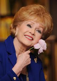 How Debbie Reynolds overcame personal tragedy and the betrayal of her best  friend Elizabeth Taylor to become 'America's sweetheart'