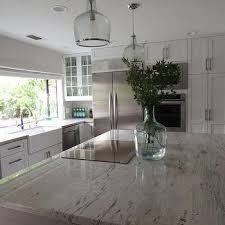 Choose the wrong countertop, and your dark color scheme in the kitchen or bath will look dreary and dull instead of polished and welcoming. River White Granite Design Ideas