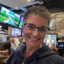 What roles do school bands play at home games?