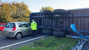 A police cordon is in place blocking access to the eastbound route towards eastbourne and hastings, while ambulances can be spotted leaving the scene. Amazon Parcels Spill Over A27 After Lorry Crashes Over Central Barrier Daily Mail Online