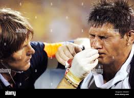 South African Sharks' Warren Britz, right, is attended by the team doctor  in a Super 14 rugby match against the ACT Brumbies in Canberra, Australia,  Saturday, March 11, 2006. The Brumbies defeated
