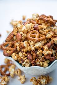 Slow Cooker Caramel Popcorn Makes An Easy And Addictive Snack Popcorn Snacks Mix Snack Mix Caramel Popcorn